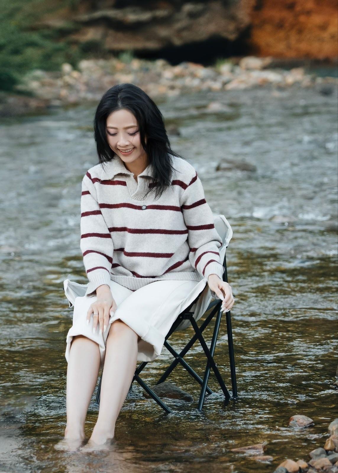 A person sitting in a chair in waterAI-generated content may be incorrect.